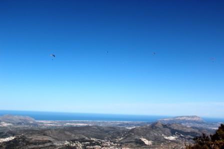 Flying over Col de Rates.  Be careful with landing zones, be wise, fly with locals.   In the distance the ever blue Mediterranean Sea.
Nick 0034 606 781 180