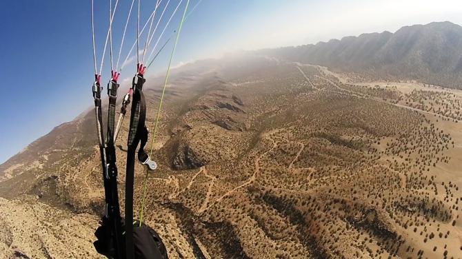 The dusty dry mountains in the south of Iran.  Make sure you have water with you, and some cereal bars,  you could land out in remote areas.  Radios not allowed.
¨We organise trips to Iran if interested thats us :
www.doyouwanna.net
