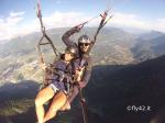 Paragliding Fluggebiet ,,Tandemflug am Vigiljoch, im Hintergrund der Tschöggelberg, links der Pferderennplatz von Meran, rechts Lana und das Etschtal.